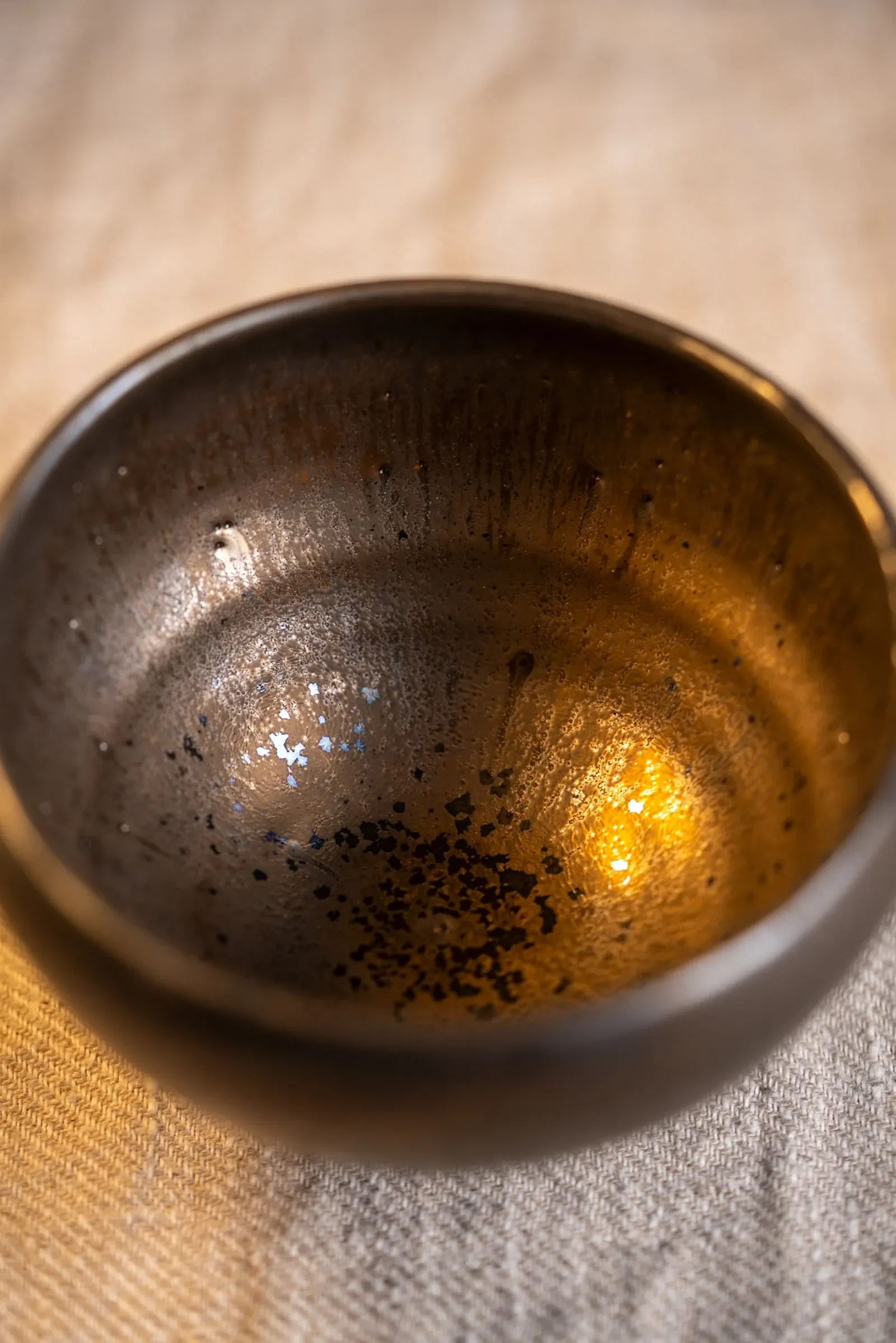 A finished bowl catching the light, seen from above